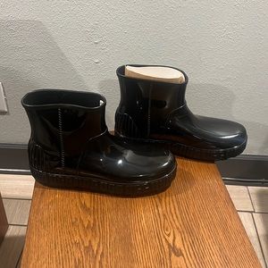 Black Ugg Rain Boots NIB never worn…smoke and pet free home. Price to sell.